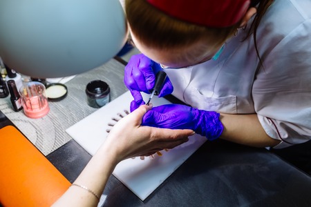 Nail care in salon. Selective focus on costumers nails. Selective focus.の写真素材