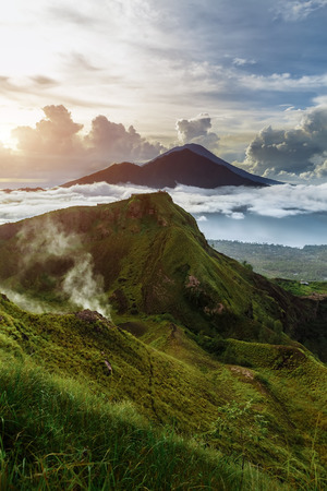 Active Indonesian volcano Batur in the tropical island Bali. Indonesia. Volcano sunrise serenity. Dawn sky at morning in mountain, travel conceptの写真素材