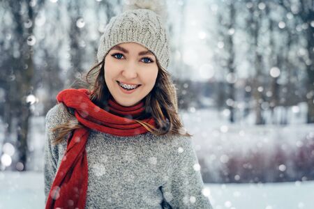 Winter young woman portrait. Beauty Joyful Model Girl laughing and having fun in winter park. Beautiful young female outdoors, Enjoying nature, wintertimeの写真素材