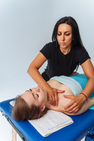 Young woman having massage in spa salon. Wellness, healing and relaxation concept.の写真素材