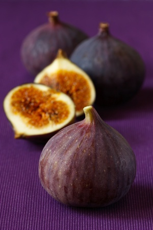 Delicious ripe figs on the purple fabric.の写真素材