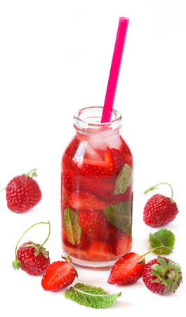 Homemade iced strawberry drink with mint on a white の写真素材
