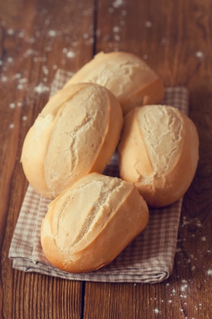 Fresh warm buns on linen napkin.の写真素材