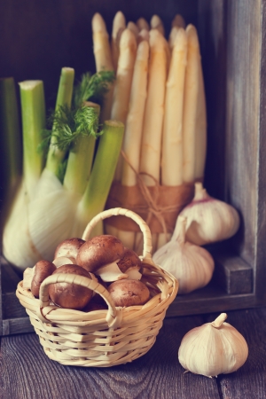 Fresh vegetables and herbs on a wooden background.Toned photo.の写真素材