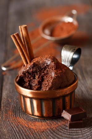 Delicious chocolate muffins with cinnamon and chocolate bar close-up.の写真素材