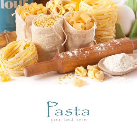 Assortment of pasta and wooden rolling pin close-up.の写真素材