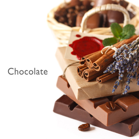 Chocolate bars with spices on a white background.の写真素材