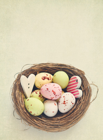 Easter chocolate eggs in a nest. Retro style.の写真素材
