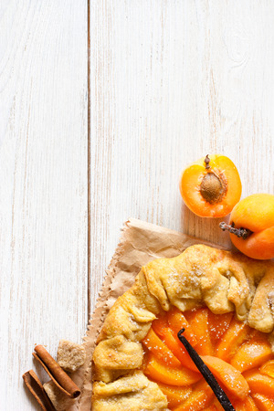 Sweet apricot pie with vanilla on a wooden background with copy space for recipe.の写真素材