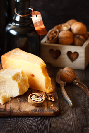 Delicious cheese and walnuts with nutcracker.の写真素材