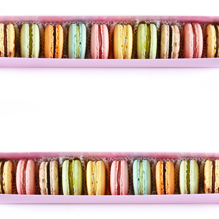 Boxes of fresh macarons on a white background with copy space.の写真素材