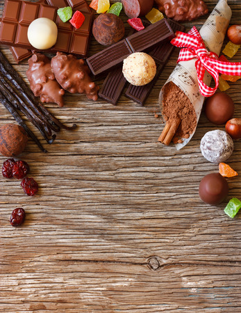 Delicious chocolates and spices on a white background.の写真素材