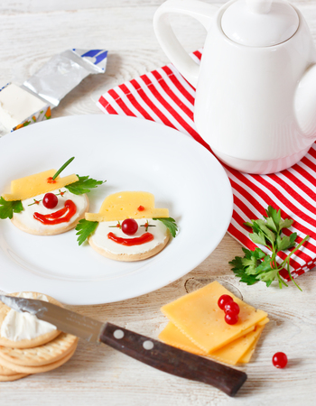 Funny clown two cheese crackers for children breakfast.の写真素材