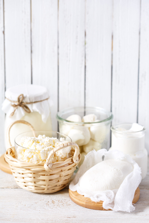 Fresh dairy products on old kitchen board. Rustic style.の写真素材