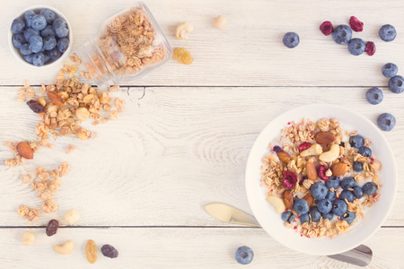 Homemade granola with fruit nuts and fresh yogurt.の写真素材