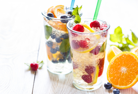 Fresh summer fruit detox iced water with berries and citrus.の写真素材