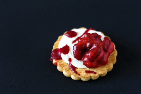 Fresh halloween bloody brain biscuits on dark background with place for text.の写真素材