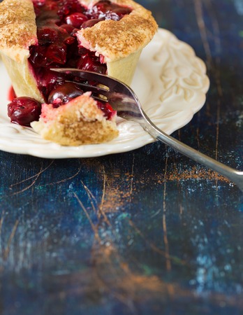 Fresh mini cinnamon sweet cherry pie close-up.の写真素材