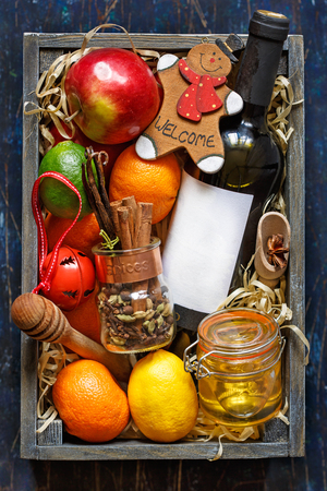 Mulled wine kit with bottle of wine, fruits and spices.の写真素材