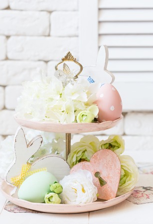 Easter pastel colored decoration in shabby chic style on tier plate.の写真素材