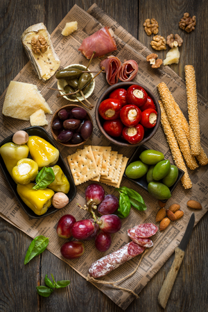 The Ultimate Appetizer Board with cheese and meat.の写真素材