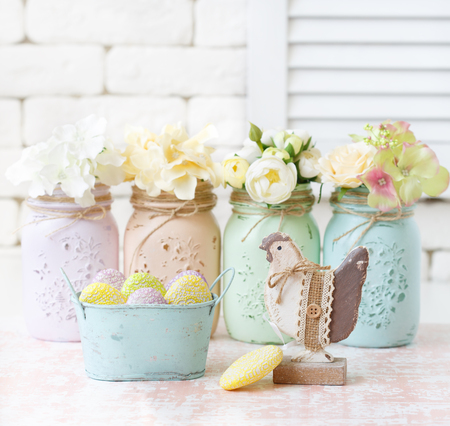 Beautiful flowers in mason jars and shabby chic decoration.の写真素材