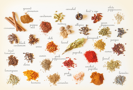 Colorful spices for cooking food on old vintage  with tags.の写真素材