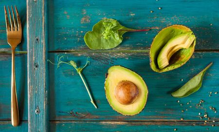Ripe avocado on a woodenの写真素材