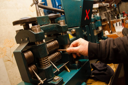 Jeweler pulls out the jewelry on the machine