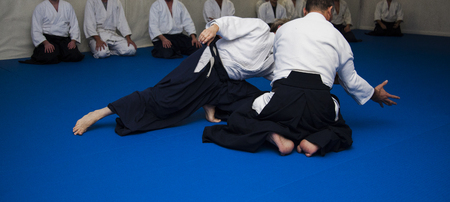 Aikidoki are fighting in aikido training. Hold the opponent's handの写真素材