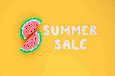 Two slices of watermelon and lettering Summer sale on yellow background. Banner with percentage sign. Promotion of the poster sale or percent discount in the store. Mock up, top view, flatlay conceptの写真素材