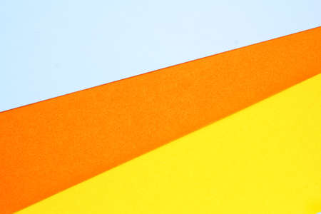 Abstract creative texture geometric candy corn pattern craft paper background. White, orange, yellow colors. Halloween autumn holiday concept. Top view with copy space for text, flの写真素材