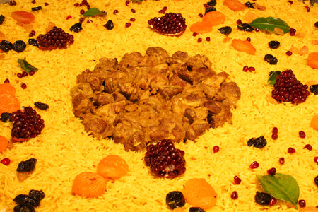 Homemade festive traditional plate pilaf with meat, vegetables and fruits. Oriental cuisine concept. Eastern, arabic, asian national hot dish. Street food marketの写真素材