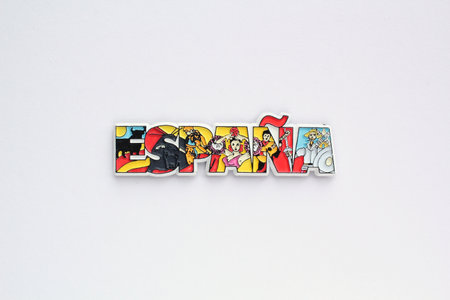Colorful PVC souvenir fridge magnet of Spain on white background. Travel memory concept. Gift product for tourists from foreign trip. Top view, flat lay, close upの写真素材
