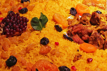 Homemade festive traditional plate pilaf with meat, vegetables and fruits. Oriental cuisine concept. Eastern, Arabic, Asian national hot dish. street food marketの写真素材