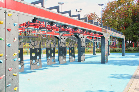 Free gym area with exercise equipment in the street. The sports ground. Outdoor fitness equipment in...