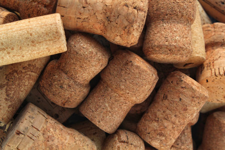 Pile of natural wooden wine corks close up as background. Concept of environmental protection and...