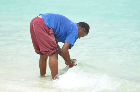 nzibar Tanzania Africa August 2016 fisherman on Nungwi Beach in Zanzibar Islandのeditorial素材