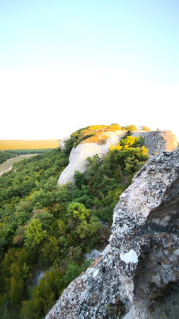 Large moss-covered mountain rocks. Natural textured stone surfaces create a dramatic wilderness...