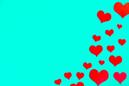 red hearts on a green background frame