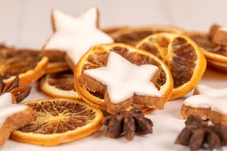 cinnamon stars with oranges for christmasの写真素材