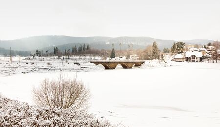 landscape with snow in cold winter in schluchsee, germanyの写真素材