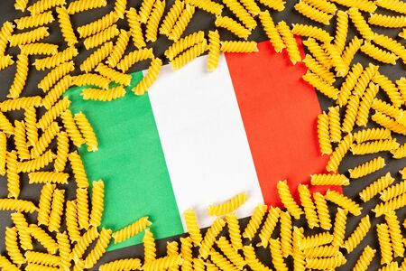 noodles with an Italy flag on black backgroundの写真素材