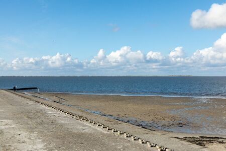 landscape north sea in germany with water, waves and sky