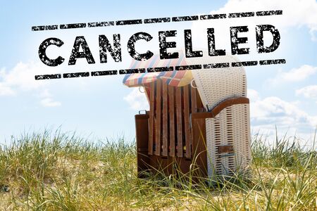 beach with beach chair and text cancelled - holiday cancel