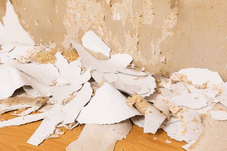 remove an old white wallpaper from the wallの写真素材