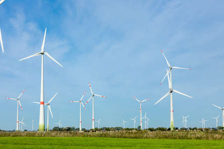 DORNUM, GERMANY - OCTOBER 10, 2019: Enercon wind turbines in a field with blue skyのeditorial素材