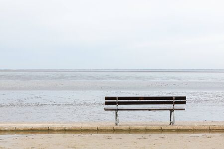 seat at north sea in germany with water, waves and sky landscapeの写真素材