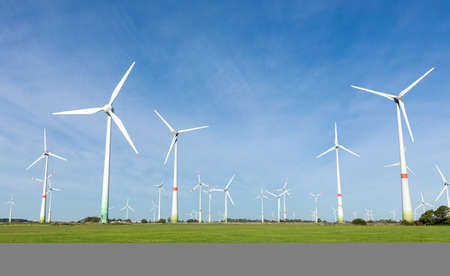 DORNUM, GERMANY - OCTOBER 10, 2019: Enercon wind turbines in a field with blue skyのeditorial素材