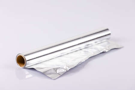 Roll of aluminum foil on a white background. Close-up.の写真素材
